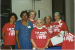 Group of women wearing 'I Am Woman, I Care, I Vote!' shirts by Author Unknown