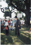 Man holding 'Let Our Ladies VOTE' sign by Author Unknown