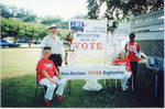 People at voter registration booth by Author Unknown