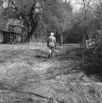 William Faulkner walking toward Andrew Price at Rowan Oak by Edwin E. Meek