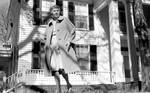 Unidentified woman walking on front lawn at Rowan Oak: Image 2 by Edwin E. Meek