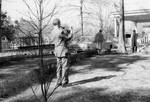 Unidentified man photographing Rowan Oak by Edwin E. Meek