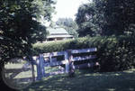 View of gate and stable at Rowan Oak by Edwin E. Meek