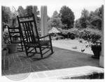 Rocking chairs on porch at Rowan Oak: Image 1 by Edwin E. Meek