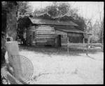 Rowan Oak - exterior grounds. Post oak barn. Scanned from a small contact sheet photo. by Edwin E. Meek