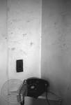 Wall of phone numbers with telephone inside Rowan Oak by Edwin E. Meek