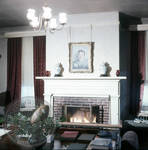 Library at Rowan Oak with fire in fireplace: Image 1 by Edwin E. Meek