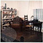 Faulkner's desk with typewriter, lamp, and bookshelves at Rowan Oak by Edwin E. Meek