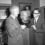 Jim Webb and unidentified man standing next to bust of William Faulkner: Image 1 by Edwin E. Meek