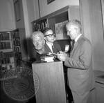Jim Webb and unidentified man standing next to bust of William Faulkner: Image 2 by Edwin E. Meek