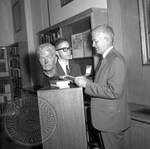 Jim Webb and unidentified man standing next to bust of William Faulkner: Image 3 by Edwin E. Meek