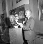Jim Webb and unidentified man standing next to bust of William Faulkner: Image 4 by Edwin E. Meek