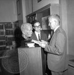 Jim Webb and unidentified man standing next to bust of William Faulkner: Image 5 by Edwin E. Meek