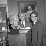 Jim Webb and unidentified man standing next to bust of William Faulkner: Image 8 by Edwin E. Meek