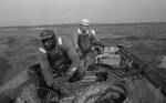 African American man and white man trolling in fishing boat: Image 2 by Edwin E. Meek