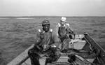 African American man and white man trolling in fishing boat: Image 3 by Edwin E. Meek