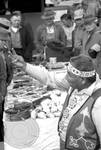 Native American man (Choctaw) in regalia sells medicine to crowd: Image 11 by Edwin E. Meek