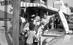 African Americans buying fish on the street: Image 1 by Edwin E. Meek