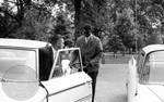 Cleve McDowell arrives on campus, exiting a car: Image 2 by Edwin E. Meek