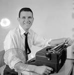 Bill Barton seated at typewriter: Image 3 by Edwin E. Meek