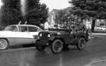Troops patrolling in Jeep with gas masks: Image 1 by Edwin E. Meek