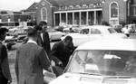James Meredith, McShane, John Door, and others in parking lot by Edwin E. Meek