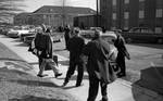 James Meredith walks to car, surrounded by news reporters by Edwin E. Meek