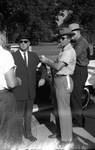 Mississippi Highway Patrol standing outside car by Edwin E. Meek