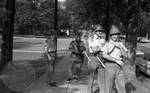 Mississippi Highway Patrol standing on sidewalk with wood batons and gas masks by Edwin E. Meek