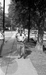 Mississippi Highway Patrol standing on sidewalk with gas mask by Edwin E. Meek