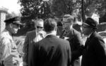 News reporters talk with police officer: Image 3 by Edwin E. Meek