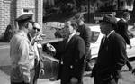 News reporters talk with police officer: Image 6 by Edwin E. Meek