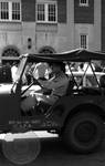 Military officer in Jeep on campus by Edwin E. Meek