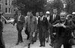 Reporters rush in front of James Meredith, James McShane, John Doar: Image 2 by Edwin E. Meek