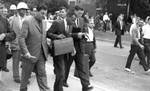 James Meredith, James McShane, and John Doar walking through campus: Image 5 by Edwin E. Meek