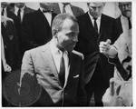 James Meredith walking to class with news reporters by Edwin E. Meek