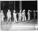 US Marshals with gas masks and clubs gather outside Lyceum at night by Edwin E. Meek