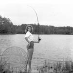 Unidentified young woman fishing: Image 1 by Edwin E. Meek
