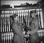 Two National Guardsmen in munitions locker. by William T. Miles