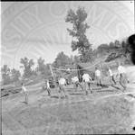 National Guardsmen playing volleyball. by William T. Miles