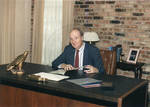 Bill Miles at his desk, from See Tupelo magazine. by Author Unknown