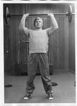 Man lifting weights, from See Tupelo magazine. by Author Unknown