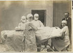 Doctor and nurses in operating room (Alice Stewart, right) by Martha Alice Stewart