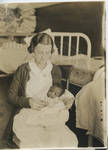 Nurse with child born at Parchman by Martha Alice Stewart