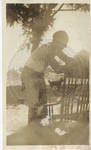 Unidentified man and rocking chair by Martha Alice Stewart