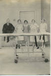 Doctor and nurses in operating room (Alice Stewart, 2nd from right) by Martha Alice Stewart