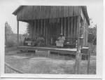 Couple Sitting on Porch (Clay County, Miss.) by John E. Phay and University of Mississippi. Bureau of Educational Research