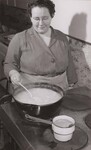 Mrs. Eleanor Sheaffer, home economics instructor in the Belleville, Mifflin County, Pa., schools, sometimes helps prepare the lunches served under the Federal-State Lunch program in the Union Township Consolidated School. by USDA