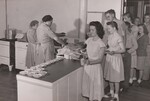 It takes good arrangement in a school lunchroom to have everything prepared and the schedule run like "clockwork" when youngsters line up for their noon meal. The Lohrville Consolidated School, Iowa, has one of the best planned programs in the State. by USDA