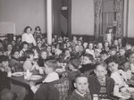 Students of Holy Rosary in school dining room. This school participates in the Federal school lunch program practically 100%. Holy Rosary School. Holyoke, Mass. by USDA
